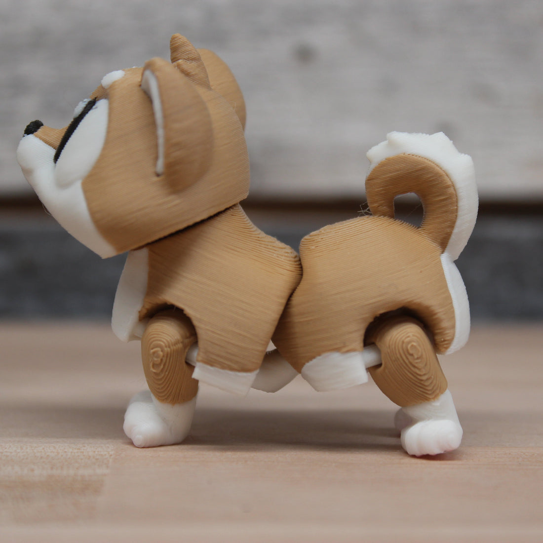 3D printed articulated brown dog figurine inspired by Odis breed